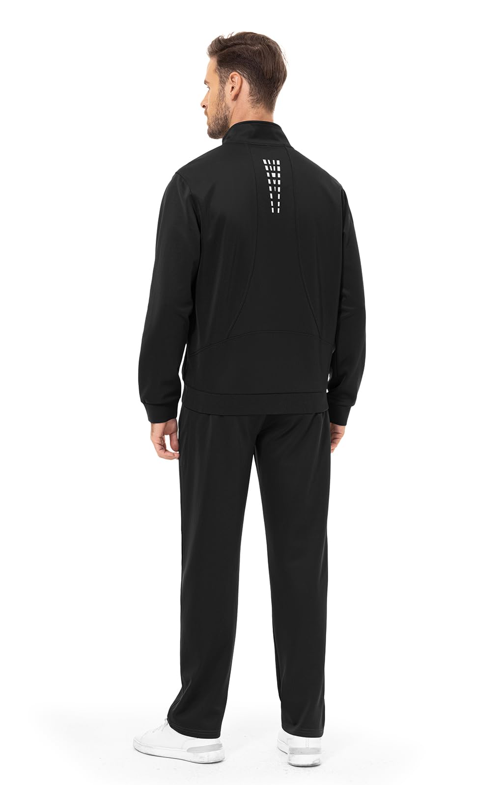 Man wearing a black tracksuit with a unique design 